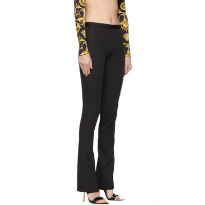 Shop Versace Black Flared Trousers In A1008 Black