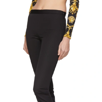 Shop Versace Black Flared Trousers In A1008 Black