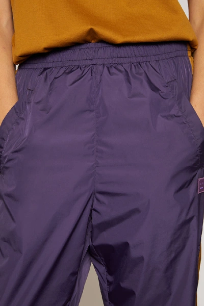 Shop Acne Studios Striped Track Pants Aubergine Purple