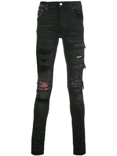 Shop Amiri Distressed Skinny Jeans In 黑色