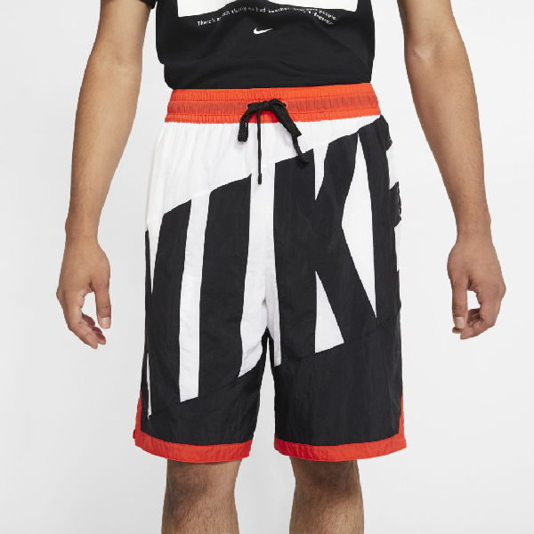 orange black and white nike shorts