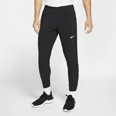 Shop Nike Men's Essential Woven Running Pants In Black