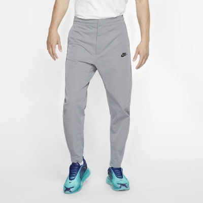 Shop Nike Sportswear Men's Woven Pants In Dark Steel Grey