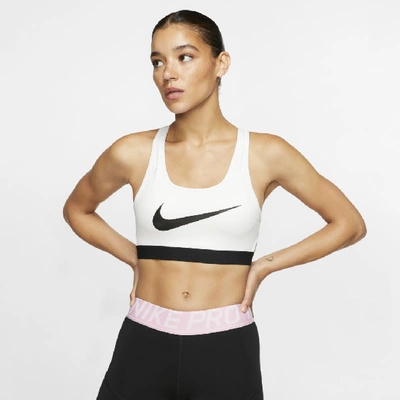 Shop Nike Classic Women's Padded Medium-support Sports Bra In White