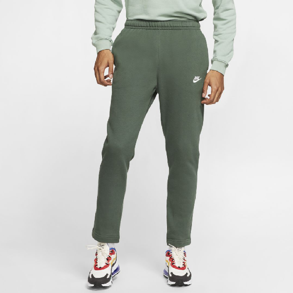 green nike trousers