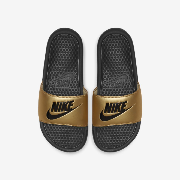 gold nike sliders