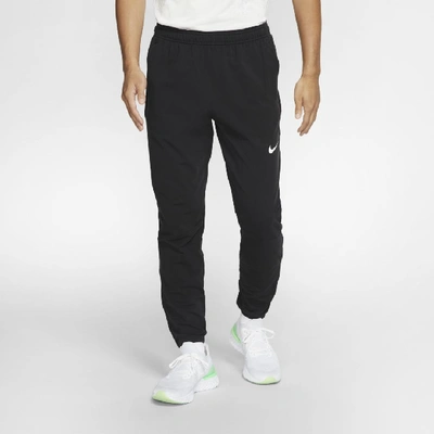 Shop Nike Therma Essential Men's Running Pants In Black