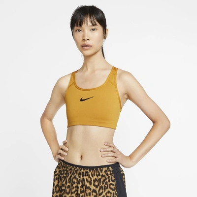 Shop Nike Swoosh Women's Medium-support Sports Bra In Gold Suede