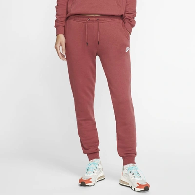 Shop Nike Sportswear Essential Women's Fleece Pants In Red