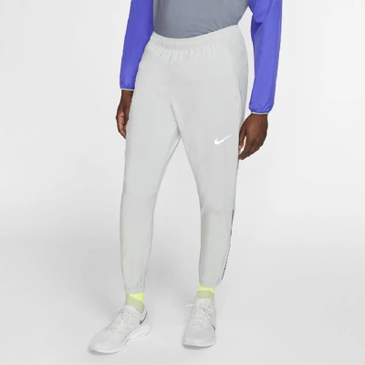Sumergir chupar declarar Nike Essential Men's Woven Running Pants In Grey | ModeSens