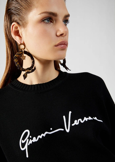 Shop Versace Embroidered Gv Signature Sweater In Black