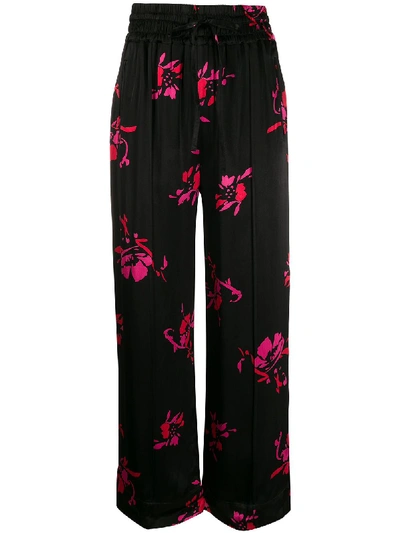 Shop Ganni Floral Print Trousers In Black
