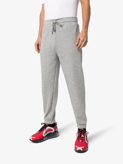 Shop Polo Ralph Lauren Logo Print Track Pants In Grey