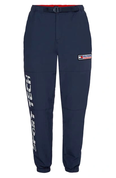 Shop Tommy Jeans Tjm Sport Tech Nylon Pants In Navy Blazer