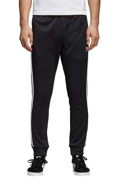 Shop Adidas Originals Track Pants In Black