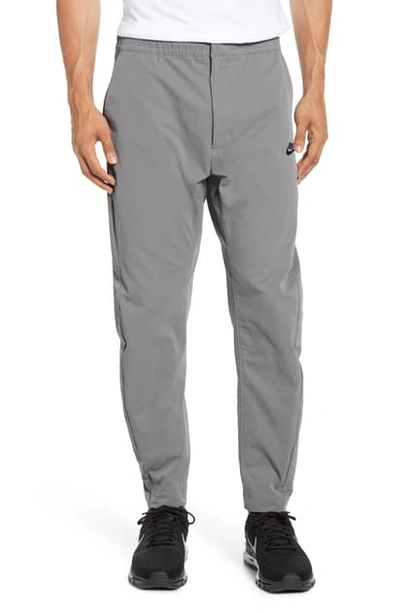 Shop Nike Sportswear Woven Pants In Dark Steel Grey/ Black