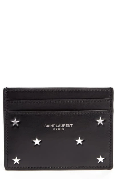 Shop Saint Laurent Star Embossed Leather Credit Card Holder - Black
