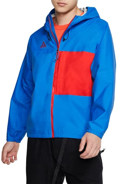 Shop Nike Packable Jacket In Lt Photo Blue/habanero Red