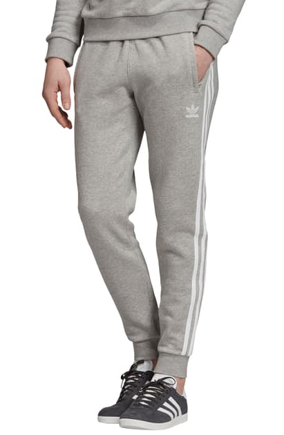 grey adidas sweatpants with white stripes