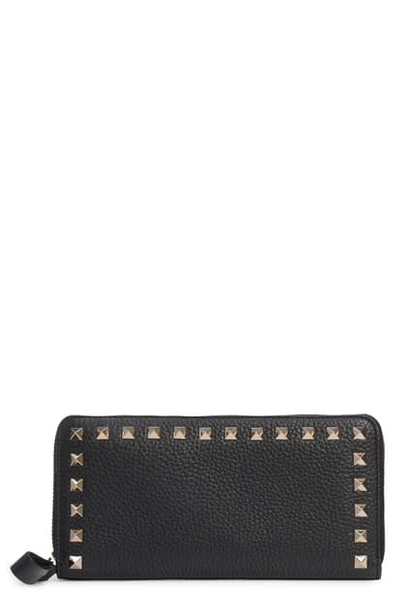 Shop Valentino Rockstud Zip Around Leather Continental Wallet - Black In Nero/ Gold