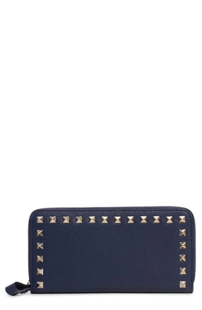 Shop Valentino Rockstud Zip Around Leather Continental Wallet In Pure Blue