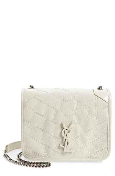 Shop Saint Laurent Niki Leather Crossbody Bag In Crema Soft