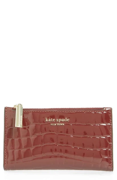 Shop Kate Spade Sylvia Croc Embossed Leather Slim Bifold Wallet - Burgundy In Cherrywood