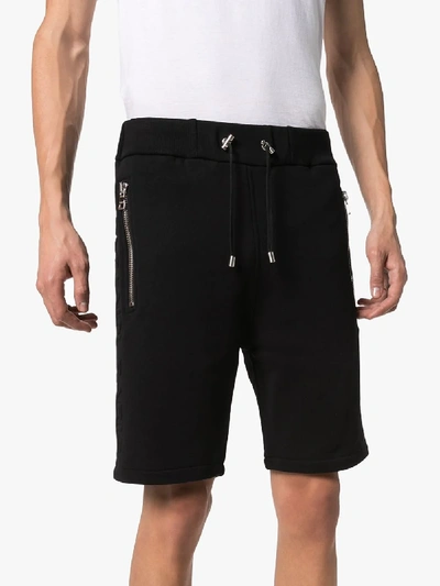 Shop Balmain Embossed Logo Cotton Track Shorts In Black
