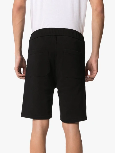 Shop Balmain Embossed Logo Cotton Track Shorts In Black