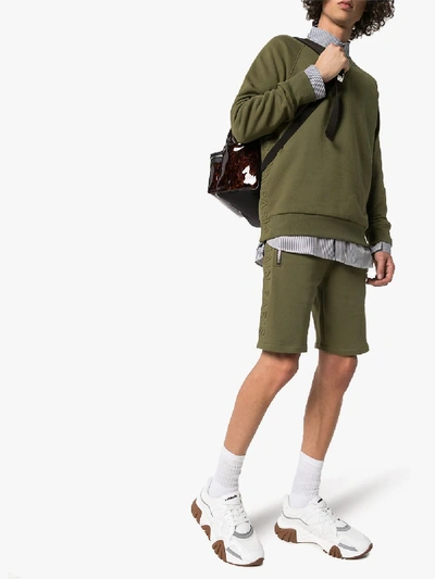 Shop Balmain Embossed Logo Cotton Track Shorts In Green