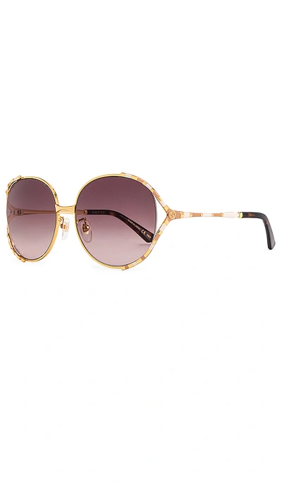 Shop Gucci Round In Shiny Yellow Gold & Brown