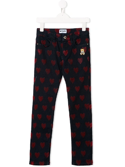 Shop Moschino Heart Pattern Jeans In Blue