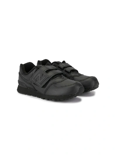 Shop New Balance 574 Low Top Sneakers In Black