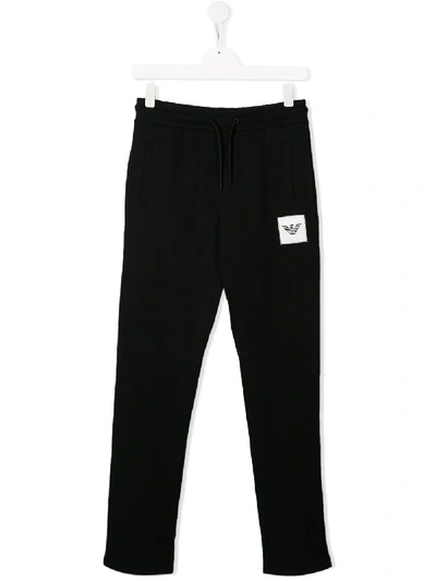 Shop Emporio Armani Logo Patch Track Pants In Black