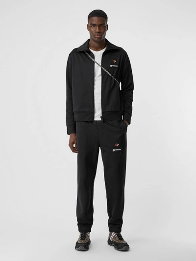 Shop Burberry Logo Graphic Jersey Trackpants In Black