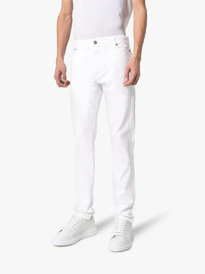 Shop Balmain Slim Fit Jeans In White