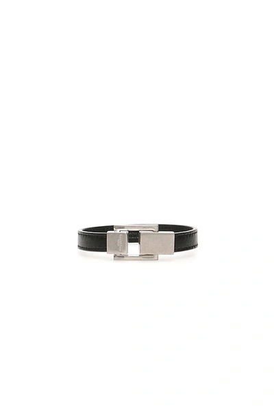 Shop Saint Laurent Leather Ysl Bracelet In Black,silver