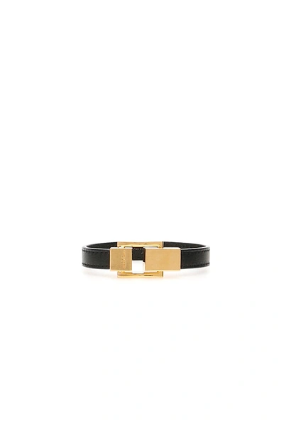 Shop Saint Laurent Leather Ysl Bracelet In Black,gold