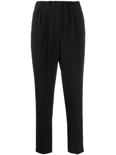 Shop Brunello Cucinelli Tapered Trousers In Black