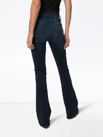 Shop Frame Le High Mid-rise Flared Jeans In Blue