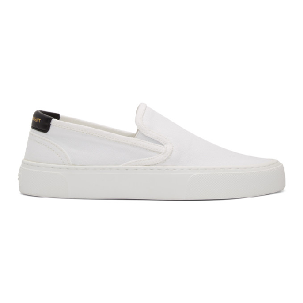 white canvas slip on sneakers