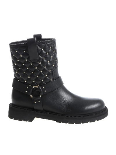 Shop Valentino Black Ankle Boots With Golden Metal Studs
