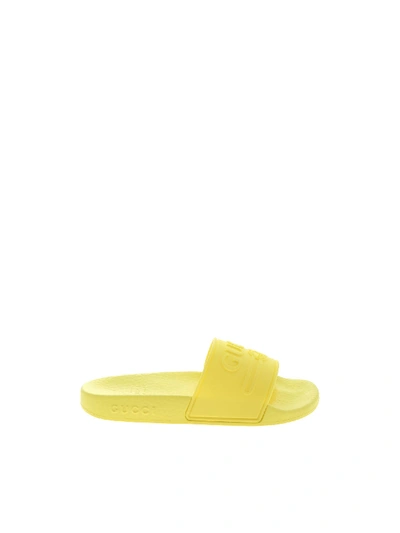 Shop Gucci Yellow Rubber Slides