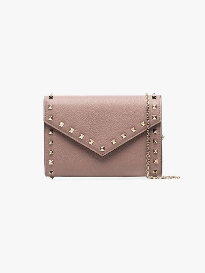 Shop Valentino Beige Rockstud Leather Clutch Bag In Neutrals