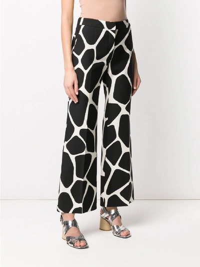 Shop Valentino Wool-silk Blend Flared Trousers In White