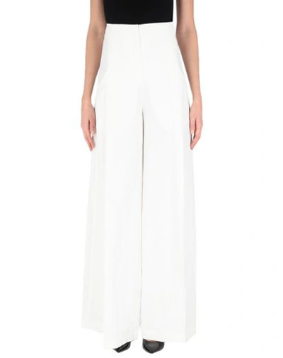 Shop Jacquemus Casual Pants In White
