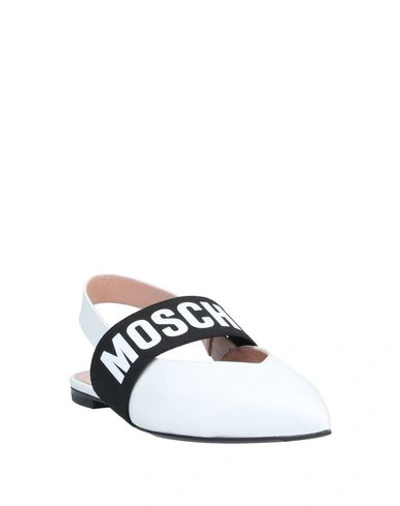 Shop Moschino Ballet Flats In White