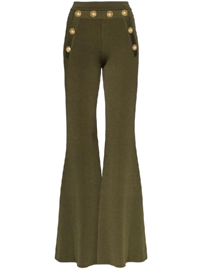 Shop Balmain Button-embellished Flared Trousers In Green