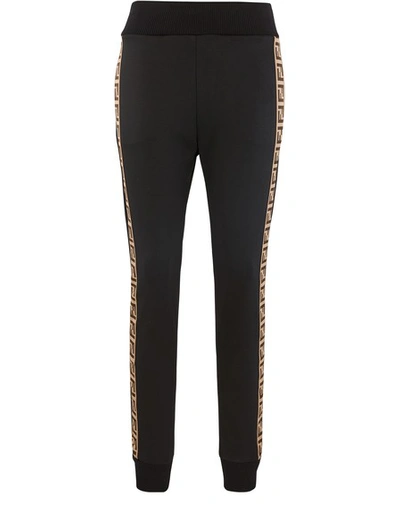 Shop Fendi Rama Jersey Trousers In Black