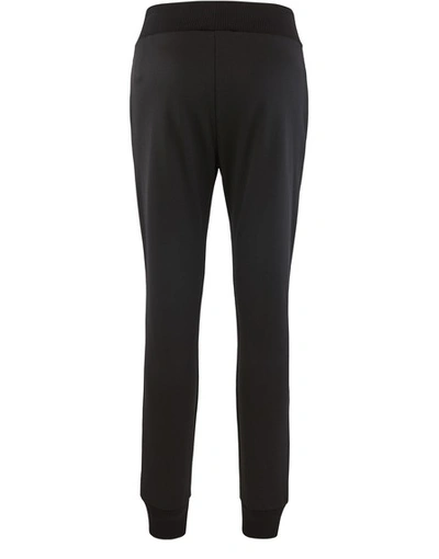 Shop Fendi Rama Jersey Trousers In Black